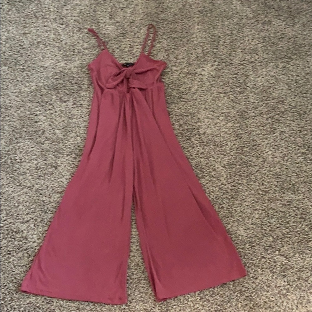 Red jumpsuit.